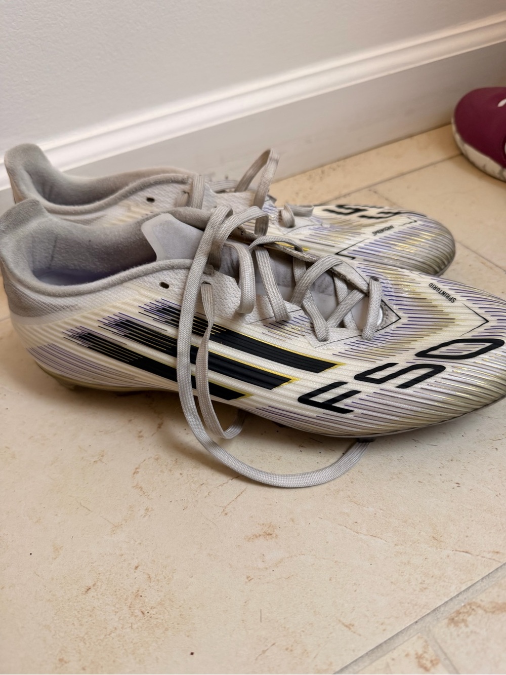 adidas Kids White Soccer Cleats with Black and Yellow Accents